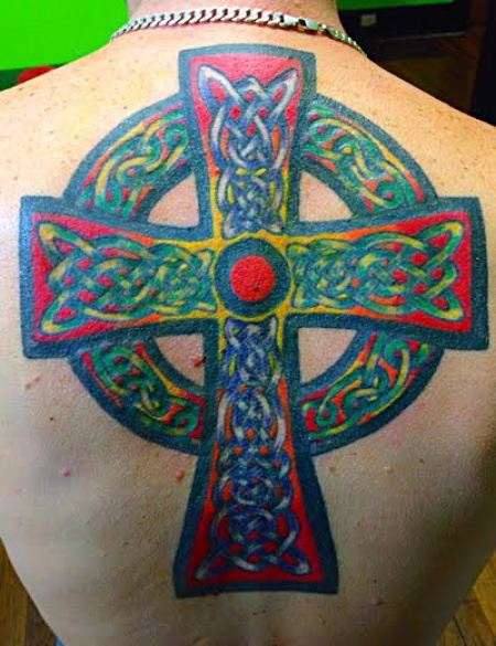 Faith-inspired tattoos make up a portion of tattoo artist Ron Hendon's business.