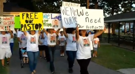 Church members from Iglesia Internacional El Verbo en Accion in Benson, N.C. rally in support of their pastor Jose Armando Siliezar-Sevilla, whom faces deportation.