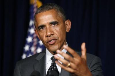 U.S. President Barack Obama makes a statement on the border crisis after his meeting with Texas Governor Rick Perry (not seen) in Dallas July 9, 2014.