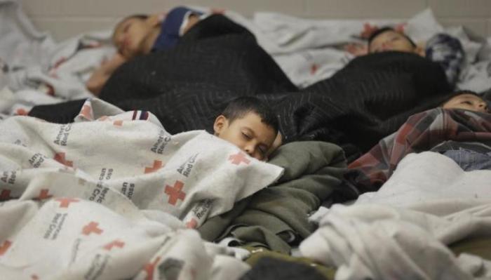 Detainees sleep in a holding cell at a U.S. Customs and Border Protection processing facility, in Brownsville, Texas June 18, 2014. CPB provided media tours June 18 of two locations in Brownsville and Nogales, Arizona, that have been central to processing the more than 47,000 unaccompanied children who have entered the country illegally since Oct. 1.