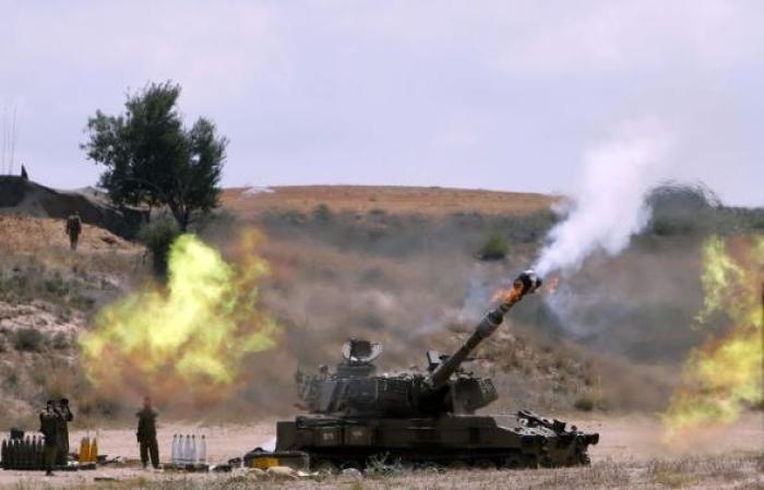 An Israeli mobile artillery unit fires towards the Gaza Strip July 18, 2014.