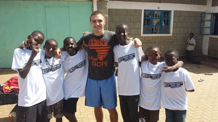 Missionary Matthew Lane Durham, 19, surrounded by African children.