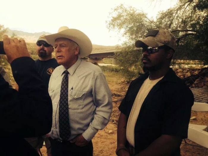 Cliven Bundy (c) prepares for a media appearance.