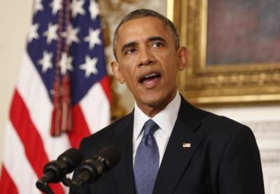 U.S. President Barack Obama talks about the humanitarian relief situation in Iraq, at the State Dining Room of the White House in Washington August 7, 2014.