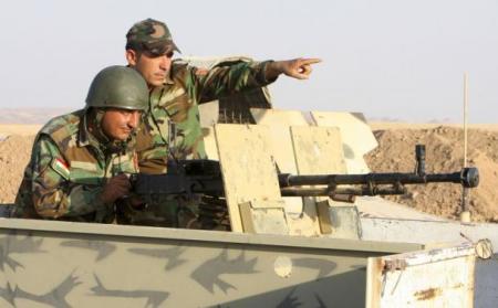 Kurdish peshmerga troops participate in an intensive security deployment against Islamic State militants on the frontline in Khazer August 14, 2014.