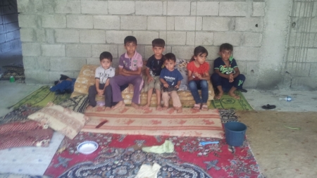 These are Yazedis who were displaced from Sinjar and fled into northern Iraq. The photo of the building, taken Aug. 14, 2014, shows the unfinished building where many families are seeking refuge.