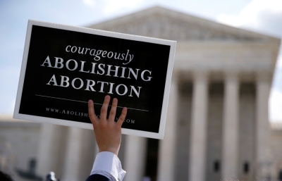 A pro-life activist with a group celebrating the U.S. Supreme Court's ruling striking down a Massachusetts law outside the Court in Washington, June 26, 2014.