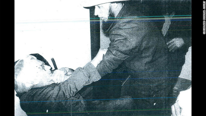 A photograph shown by the federal court of an Amish man having his beard forcefully cut.