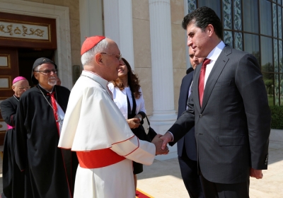 Iraq's Kurdistan Prime Minister Nechirvan Barzani shakes hands with Pope Francis' personal envoy to Iraq Cardinal Fernando Filoni in Arbil at Iraq's Kurdistan region, August 13, 2014.