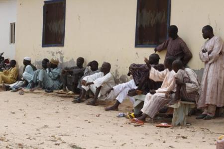 Refugees gather in an internally displaced persons camp, that was set up for Nigerians fleeing the violence committed against them by Boko Haram militants, at Wurojuli, Gombe State, Sept. 1, 2014.