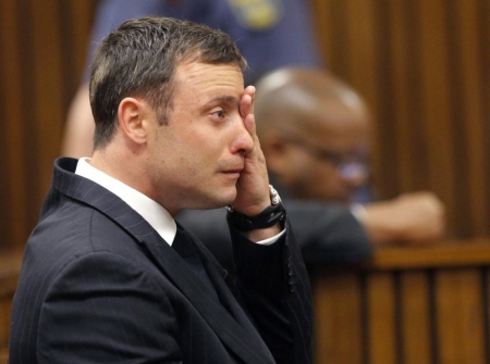 Olympic and Paralympic track star Oscar Pistorius reacts as he listens to Judge Thokozile Masipa's judgement at the North Gauteng High Court in Pretoria, September 11, 2014.