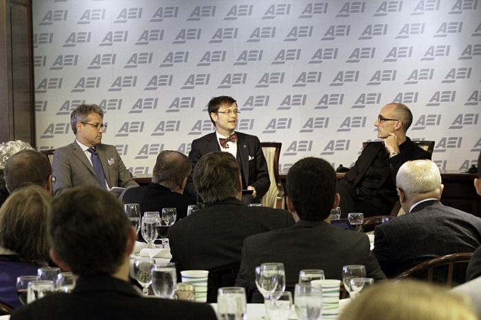 Attendees listen to a panel discussion at the inaugural Evangelical Leadership Summit hosted by the American Enterprise Institute in Washington, D.C. on Wednesday, Sept. 10, 2014. From L to R: Eric Metaxas, author of the best selling book 'Bonhoeffer: Pastor, Martyr, Prophet, Spy;' Greg Thornbury, president of The King's College in New York City and panel moderator; and AEI President Arthur C. Brooks.