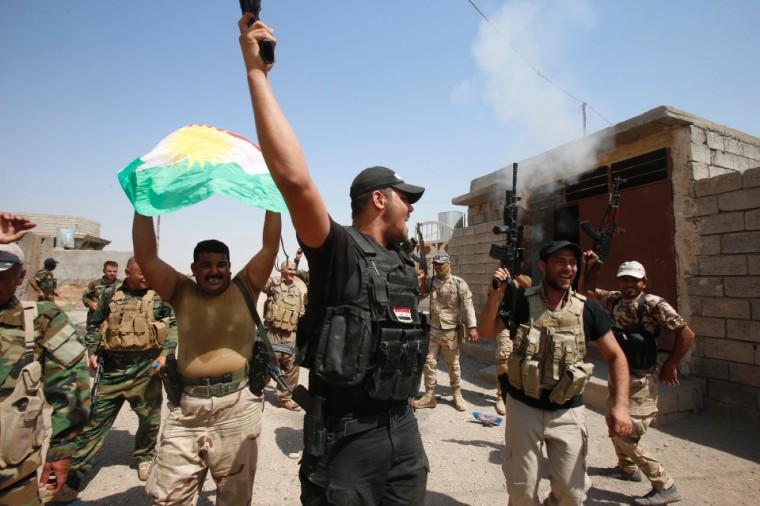 Kurdish peshmerga forces celebrate as they take control of Sulaiman Pek from the Islamic State militants, in the northwest of Tikrit city, Iraq, September 1, 2014.