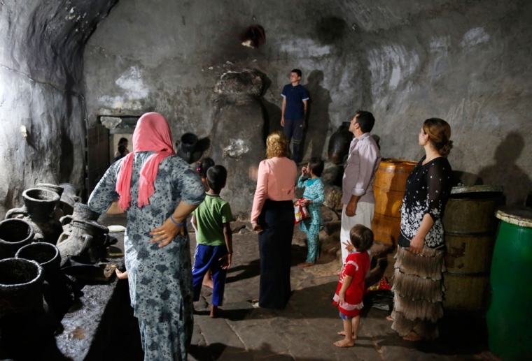 DATE IMPORTED:September 20, 2014Displaced people from the minority Yazidi sect, who fled violence in the Iraqi town of Sinjar, worship at their main holy temple Lalish in Shikhan September 20, 2014. Followers of an ancient religion derived from Zoroastrianism, the Yazidi fled their homeland in the Sinjar mountains as Islamic State militants, who see them as devil worshippers, seized towns and carried out mass killings in August.