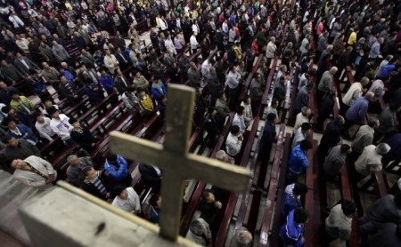 Worshipers pray during a mass at the Liuhe Catholic Church in Liuhe village on the outskirts of Qingxu county, northern China, in this undated photo.