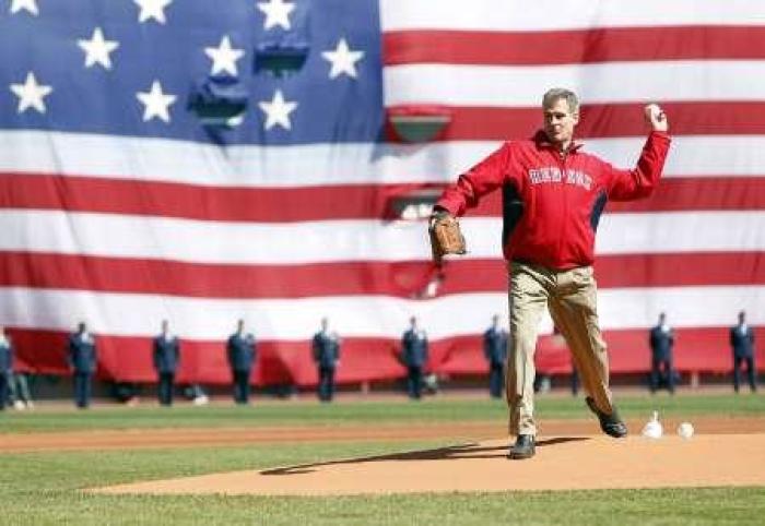 U.S. Senator Scott Brown throws out the first pitch prior to a MLB baseball game between the Boston Red Sox and the Toronto Blue Jays in Boston, Massachusetts, April 18, 2011.