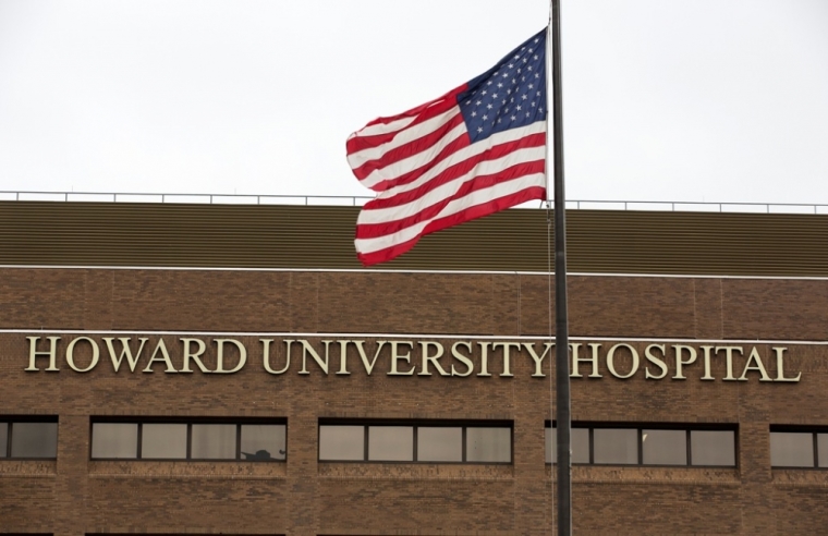 The American flag flies in front of Howard University Hospital in Washington, October 3, 2014. Howard University Hospital has admitted a patient with possible symptoms of the deadly Ebola virus 'in an abundance of caution,' it said in a statement on Friday. The patient, who had recently traveled to Nigeria, is in stable condition and is being treated in isolation, a hospital spokeswoman said, adding that she could not provide additional details about the case because of patient privacy.