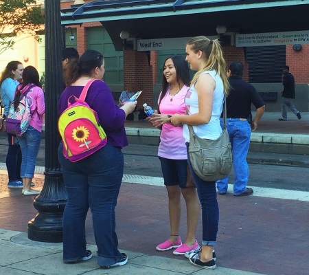 Harvest America youth ministry team passes out thousands of invites and talks about the Gospel prior to Greg Laurie's evangelistic event in Dallas, Oct. 5, 2014.