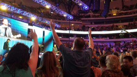 Harvest America attendees make professions of faith in Jesus Christ after hearing pastor Greg Laurie share the Gospel with a sold-out crowd of 19,000 for Harvest America at the American Airlines Center and Victory Park in Dallas, Texas, Oct. 5, 2014.