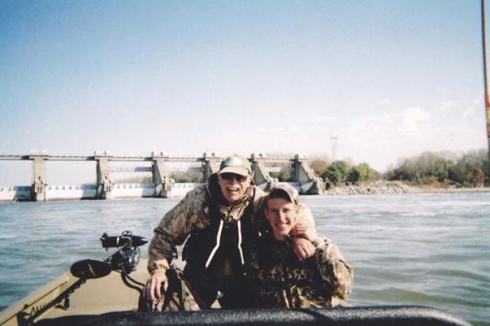 Abdul-Rahman Kassig fishes with his father, Ed Kassig, near the Cannelton Dam on the Ohio River in southern Indiana in 2011 in this photo courtesy of the Kassig family.