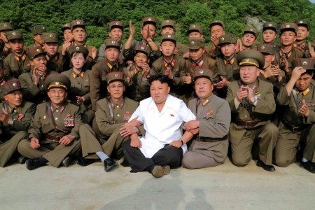 North Korean leader Kim Jong Un poses with soldiers in this undated photo released by North Korea's Korean Central News Agency (KCNA) in Pyongyang June 30, 2014.