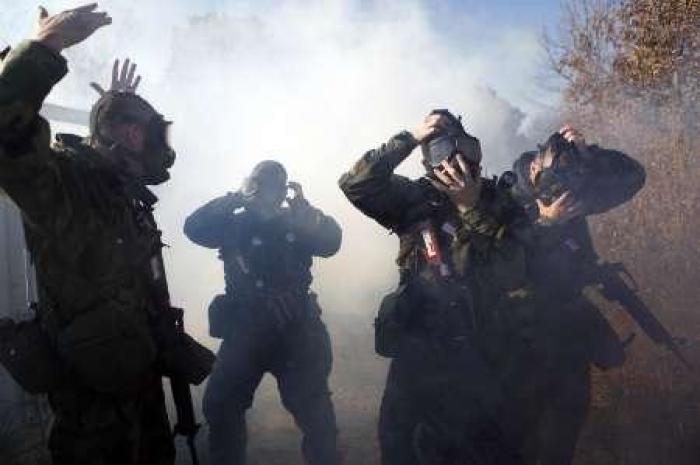 U.S. Army recruits go through chemical weapons training during basic training at the Fort Sill Army Post in Fort Sill.