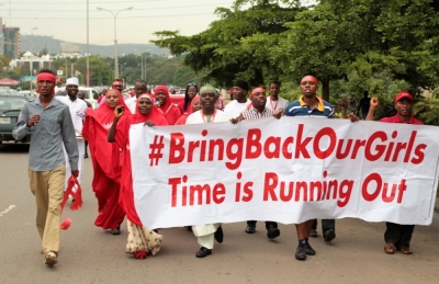 Campaigners from '#Bring Back Our Girls' march during a rally calling for the release of the Abuja school girls who were abducted by Boko Haram militants, in Abuja, Nigeria, October 17, 2014. Nigeria said on Friday it had agreed a ceasefire with Islamist militants Boko Haram and reached a deal for the release of more than 200 schoolgirls kidnapped by the group six months ago.