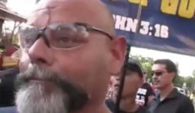 Bible Believers street preacher Ruben Israel gets cut by a stone thrown at him as he and 11 other preach the Gospel at an Arabic festival in Dearborn, Michigan.