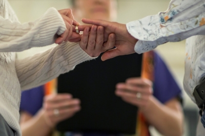 April Breeden (L) places a ring on the finger of her partner, Crystal Peairs, during their wedding ceremony at City Hall in St. Louis, Missouri, November 5, 2014. Missouri's ban on same-sex marriage is unconstitutional, a St. Louis circuit judge ruled Wednesday, adding momentum to efforts in states across the country to legalize gay nuptials.