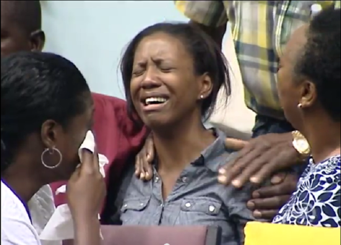 A member of Dr. Myles Munroe's Bahamas Faith International church weeps after hearing the renowned speaker was killed along with his wife Ruth and seven others in a fiery jet crash on Sunday November 9, 2014.