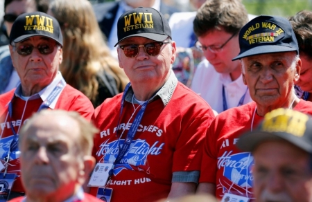 World War II veterans from Rhode Island listen during a ceremony at the National World War II Memorial marking the 70th anniversary of the D-Day invasion of Europe on June 6, 1944, while in Washington, June 6, 2014. The veterans arrived on the Rhode Island Association of Fire Chiefs Foundation honor flight earlier today.