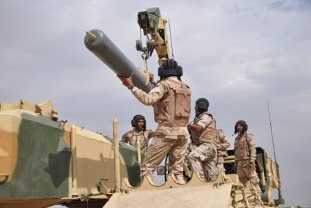 Iraqi Army soldiers work in a Russian-made multiple rocket launcher known as the TOS-1A during training at a military camp in Baghdad, October 14, 2014. The Iraqi army will deploy the weapon to the frontlines, the country's ministry of defense said.