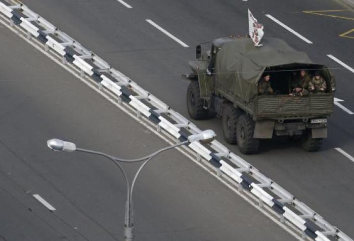 Militants supporting the self-proclaimed Donetsk People's Republic ride in a truck in Donetsk, eastern Ukraine, November 12, 2014.