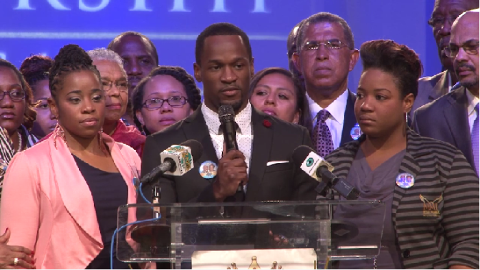 Myles Munroe Jr. (at podium) talks about the recent jet crash that killed nine people including his parents in the Bahamas.