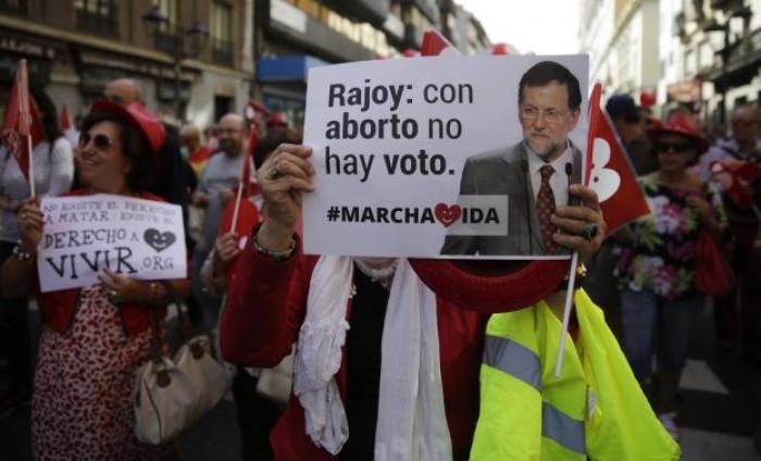 Pro-life demonstrators hold placards against abortion in central Madrid, Spain, in this September 21, 2014 file photo.