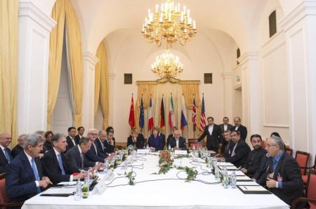 Delegations of U.S. Secretary of State John Kerry, Britain's Foreign Secretary Philip Hammond, Russian Foreign Minister Sergei Lavrov, Iranian Foreign Minister Javad Zarif, German Foreign Minister Frank-Walter Steinmeier, French Foreign Minister Laurent Fabius, EU High Representative Catherine Ashton, Chinese Foreign Minister Wang Yi sit around the negotiations table during their meeting in Vienna November 24, 2014.