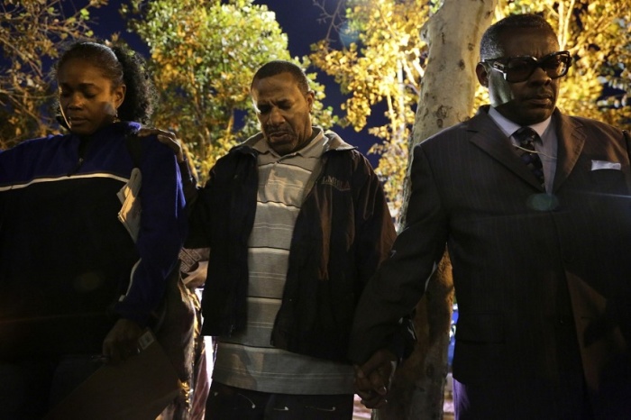 People pray during a demonstration in Los Angeles after the grand jury decision in the shooting of Michael Brown by police officer Darren Wilson, Nov. 24, 2014.