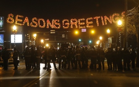 Police attempt to hold ground during demonstration on main street in Ferguson, Missouri, Nov. 24, 2014.