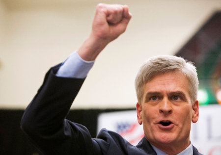 Republican U.S. Representative Bill Cassidy pumps his fist after winning the run-off election for U.S. Senate against Democrat Mary Landrieu in Baton Rouge, Louisiana, December 6, 2014.