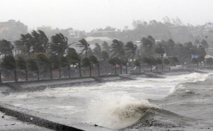 Strong winds and waves brought by Typhoon Hagupit pound the seawall in Legazpi City, Albay province southern Luzon December 7, 2014.