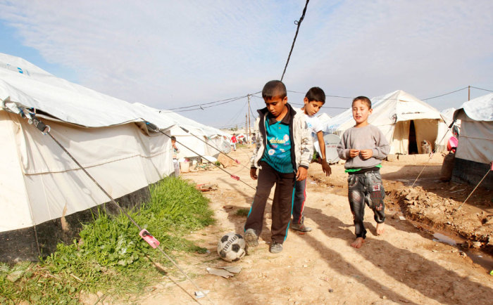 Children, who fled from in the Iraqi town of Jalawla, play in the Ali Awa refugee camp, near Khanaqin city, December 1, 2014. The blood of two militants killed during Islamic State's rout in the Iraqi town of Jalawla has yet to be washed away, but a turf war is already brewing between Kurdish and Shi'ite forces that jointly drove the insurgents out. The recapture of disputed territory and towns such as Jalawla is reopening rivalries over the boundary between areas of Kurdish control and those administered by the Shi'ite-led Baghdad government. Local Sunni Arabs displaced in the fighting have little choice but to align themselves with one side or the other. Not long after Islamic State began its offensive across Iraq this summer, Kurdish commanders in the eastern province of Diyala invited the head of the largest Sunni Arab tribe in Jalawla to discuss jointly resisting the insurgents. Picture taken December 1, 2014.