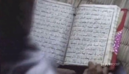 A woman in Sauidi Arabia reads from a Bible translated in Arabic