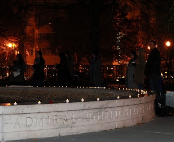 People gather at the Dupont Circle fountain in Washington, D.C. for a vigil in remembrance of the more than 140 people killed in a terrorist attack at the military-run Army Public School in Peshawar, Pakistan. The vigil was held Wednesday, December 17, 2014.