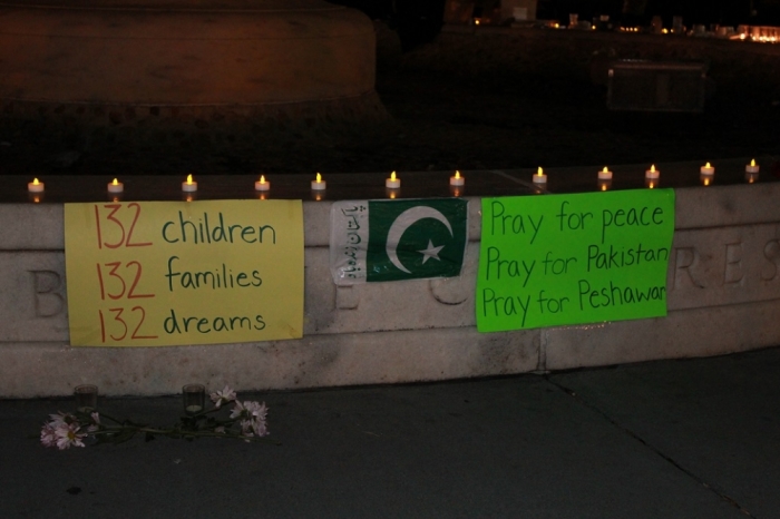 People gather at the Dupont Circle fountain in Washington, D.C. for a vigil in remembrance of the more than 140 people killed in a terrorist attack at the military-run Army Public School in Peshawar, Pakistan. The vigil was held Wednesday, December 17, 2014.