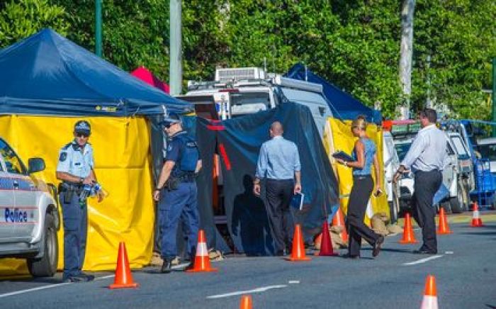 Detectives work at the scene of a stabbing attack at a home in Cairns, northern Queensland, December 19, 2014.