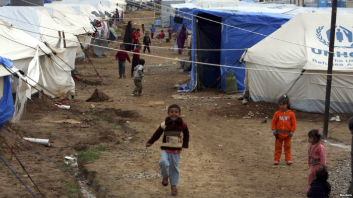 Displaced Iraqi children, who fled from Islamic State violence in Mosul, play in refugee camp on the outskirts of the Kurdish city of Arbil, Dec. 1, 2014.