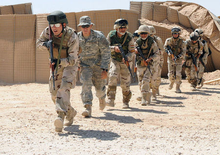 Members of the 7th Iraqi Army Division's Commando Battalion hone air assault techniques under the eye of U.S. Soldiers of the 504th Parachute Infantry Regiment