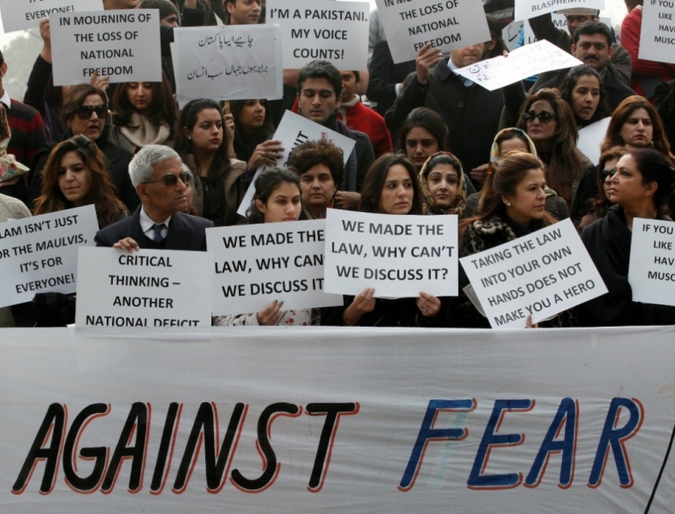 Residents hold placards during a rally protesting the killing of the Governor of Punjab Salman Taseer in Lahore, January 8, 2011. Taseer was shot dead by one of his guards, who was apparently incensed by the politician's opposition to the blasphemy law, in Islamabad on January 4, 2011.