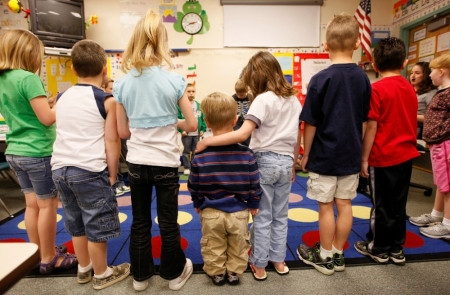 First-grader Adam Kotzian (C) does a spelling drill with classmates in his classroom at Eagleview Elementary school in Thornton, Colorado, on March 31, 2010.