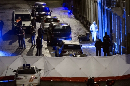 Belgian police inspect an apartment in central Verviers, a town between Liege and the German border, in east Belgium, January 15, 2015. Belgian police killed two men who opened fire on them during one of about a dozen raids on Thursday against an Islamist group that federal prosecutors said was about to launch 'terrorist attacks on a grand scale'. A third man was detained in the eastern city of Verviers, where police commandos ran into a hail of gunfire after trying to gain entry to an apartment above a town centre bakery.